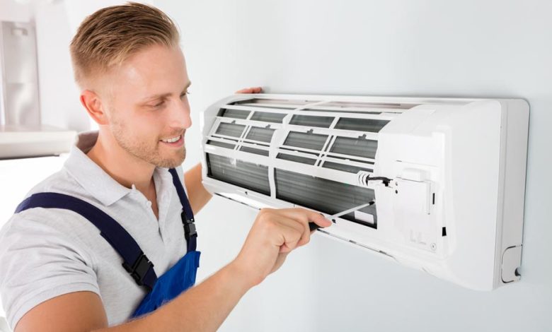 man doing air conditioner service