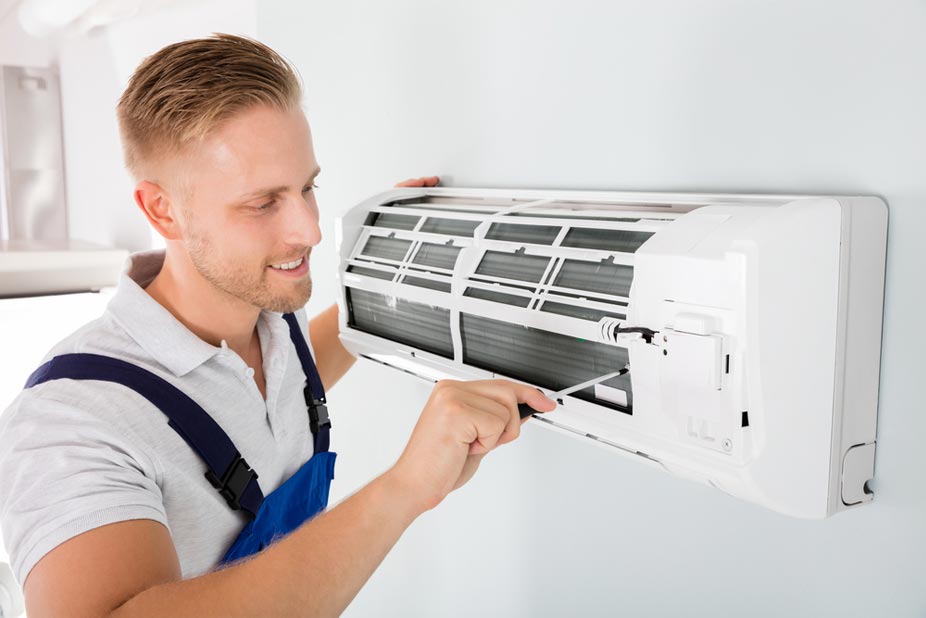 man doing air conditioner service