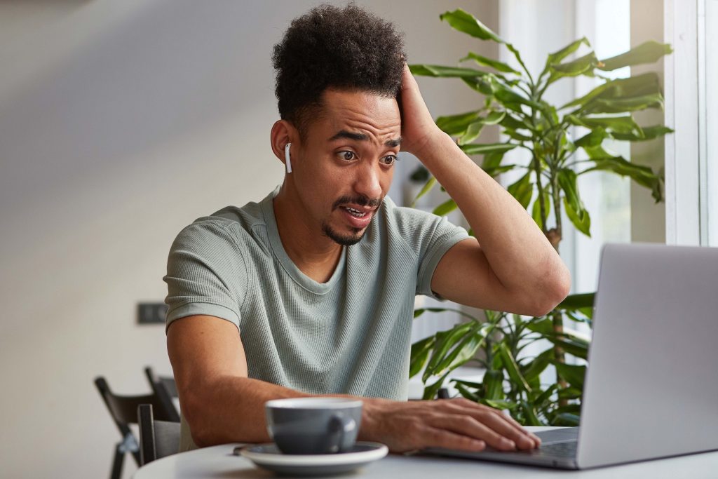 Confused Man reading about misconceptions